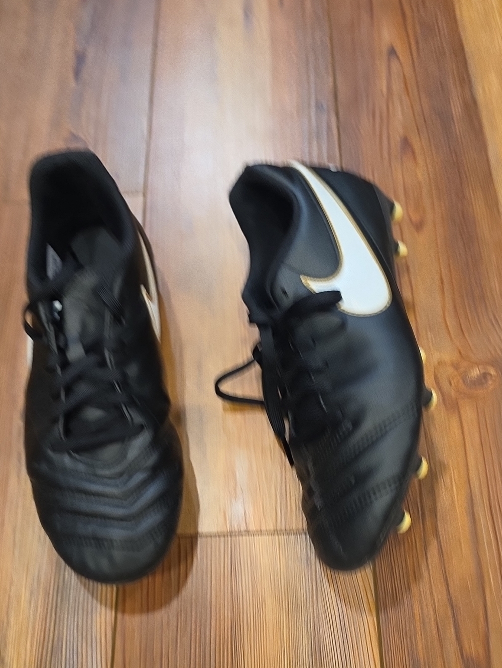 Nike Men’s Black Soccer Cleats with White Swoosh and Gold trim